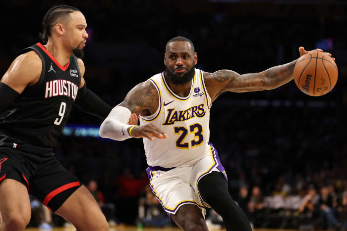 Lakers forward LeBron James (23) dribbles against Houston Rockets forward Dillon Brooks (9) during the second quarter at Crypto.com Arena.